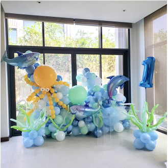 Under the sea (Mini balloon wall with octopus(golden rod and 3 fishes (foils) approx. 1.5m high  3 x sea weeds 1 x Medium and 1 x large acrylic table personalization on the balloons Number 1 foil balloon)