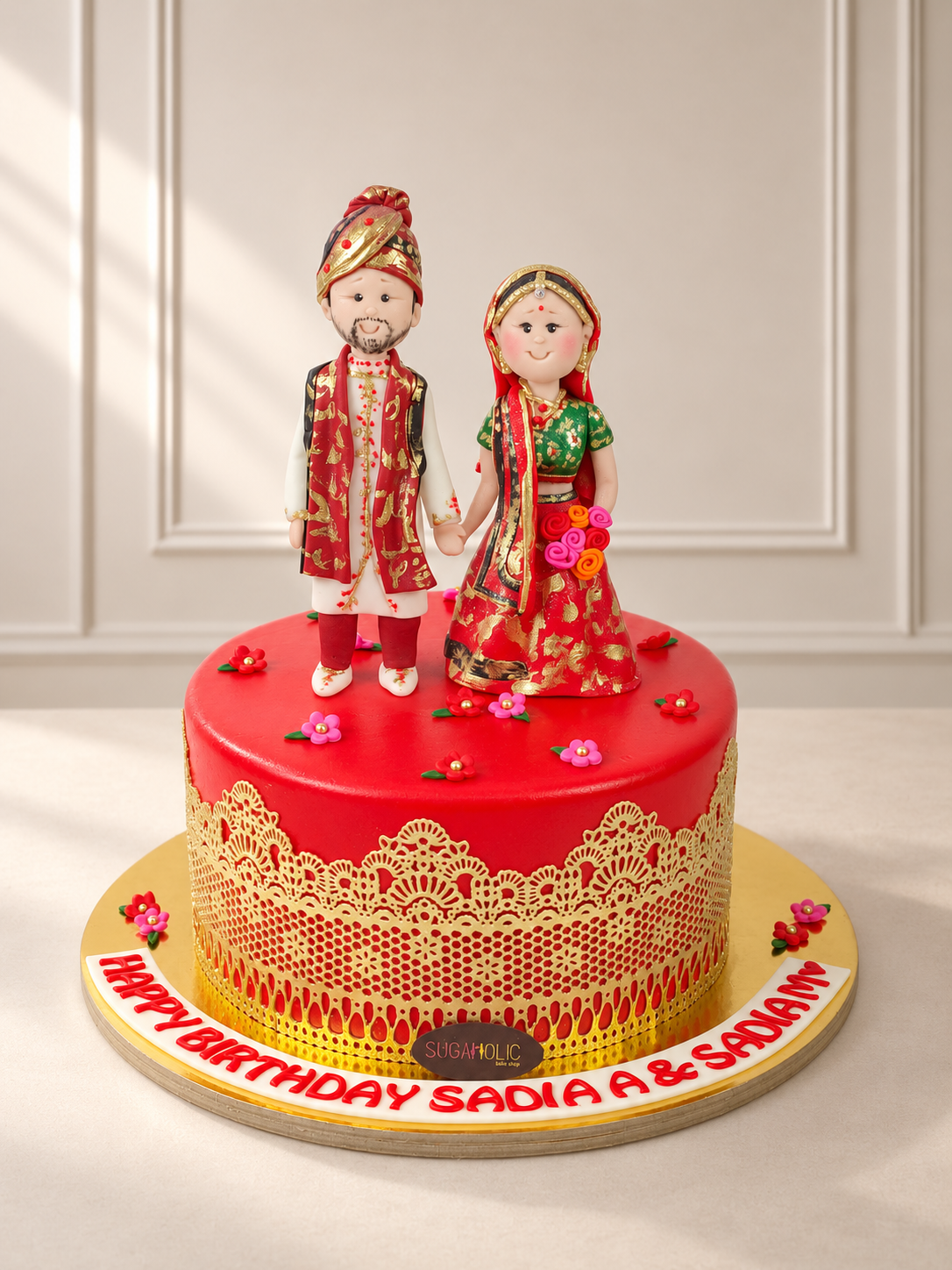 Red and Gold Traditional Wedding Couple Cake