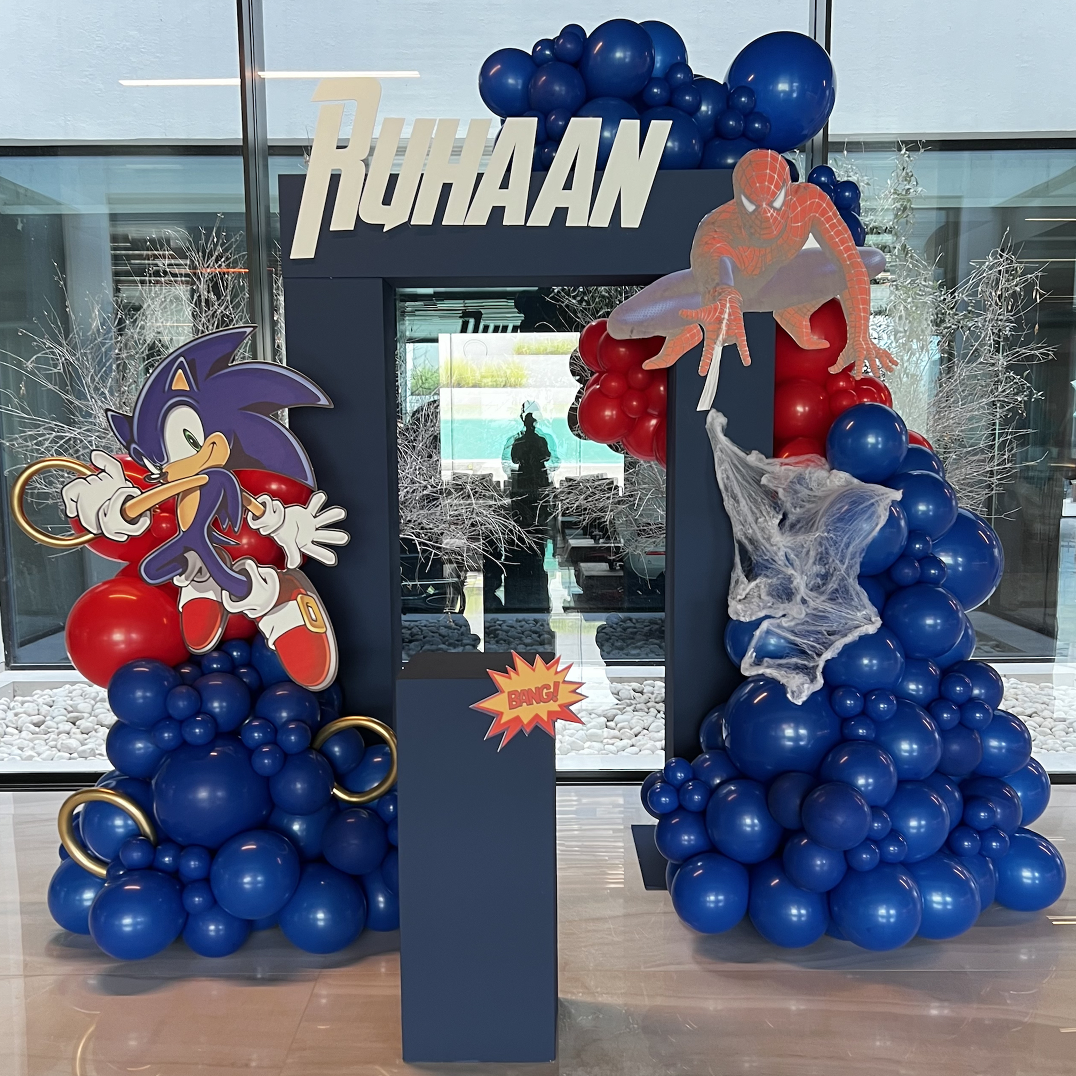 Sonic and Spiderman Theme (1x H -2.2m x 1.5m box hollow Personalisation on backdrop Balloon garland 1 x Large Square plinth 1 x Large Square plinth 2x foamboard elements)