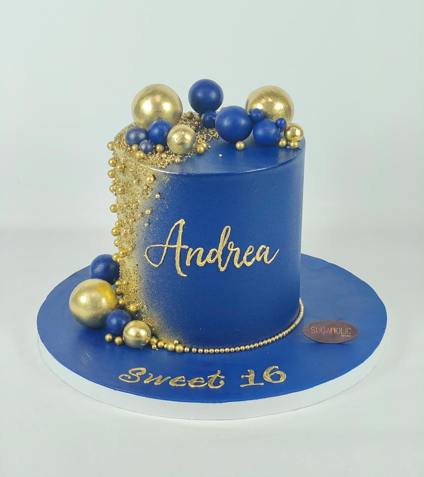 Royal Blue and Gold Sphere Buttercream Cake